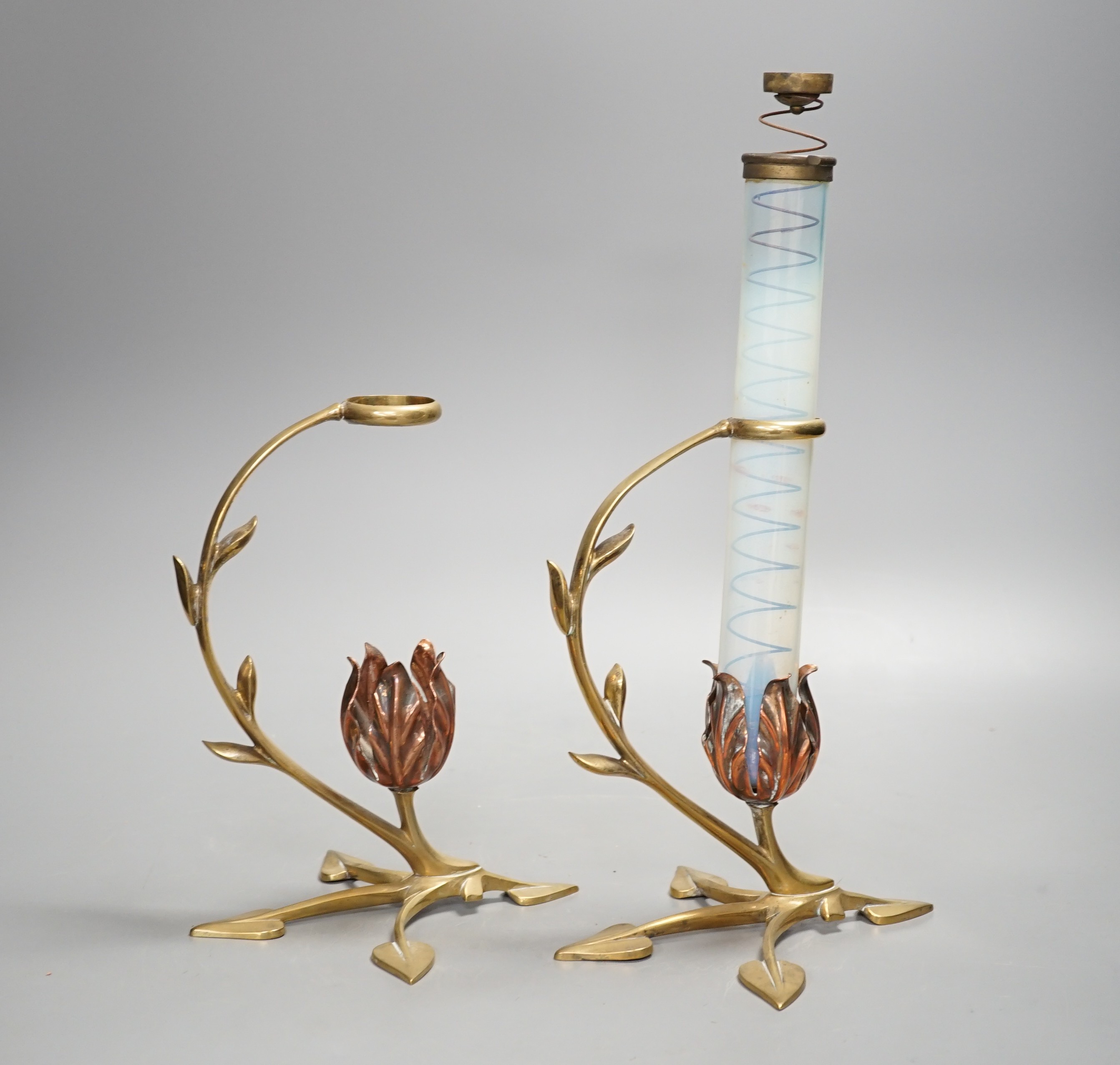 Attributed to W.A.S. Benson, a pair of brass and copper cradle lamps, one with original vaseline glass shade with candle ejector. Total height 31cm